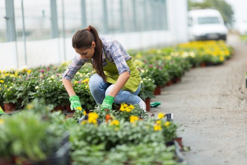 Gardener reviewing a service complaint with notes